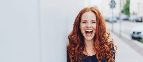 woman laughing after dental care